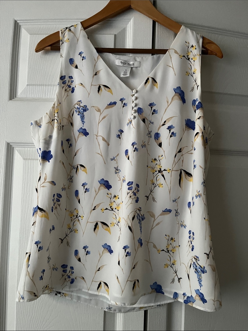 White Floral Sleeveless V-Neck Blouse with Blue Accents